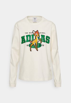 Långärmad t-shirt i krämfärg med färggrafik av Bambi och grön "ADIDAS"-text, tillverkad av mjuk bomull. Diskret logodetalj vid fållen.