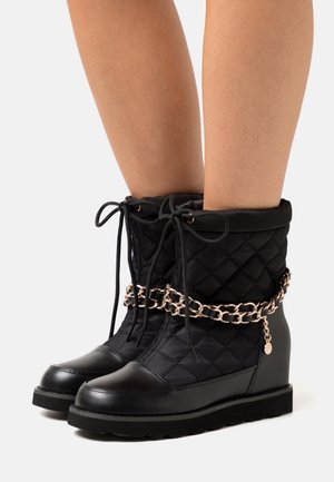 Anna Field Kotníkové boty na klínu - black