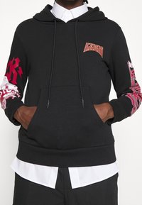Iceberg Jersey con capucha - black