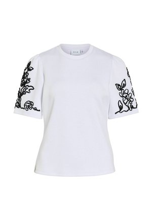 Chemise blanche à manches courtes avec manches bouffantes ornées de broderie florale noire sur les deux bras et un col rond.