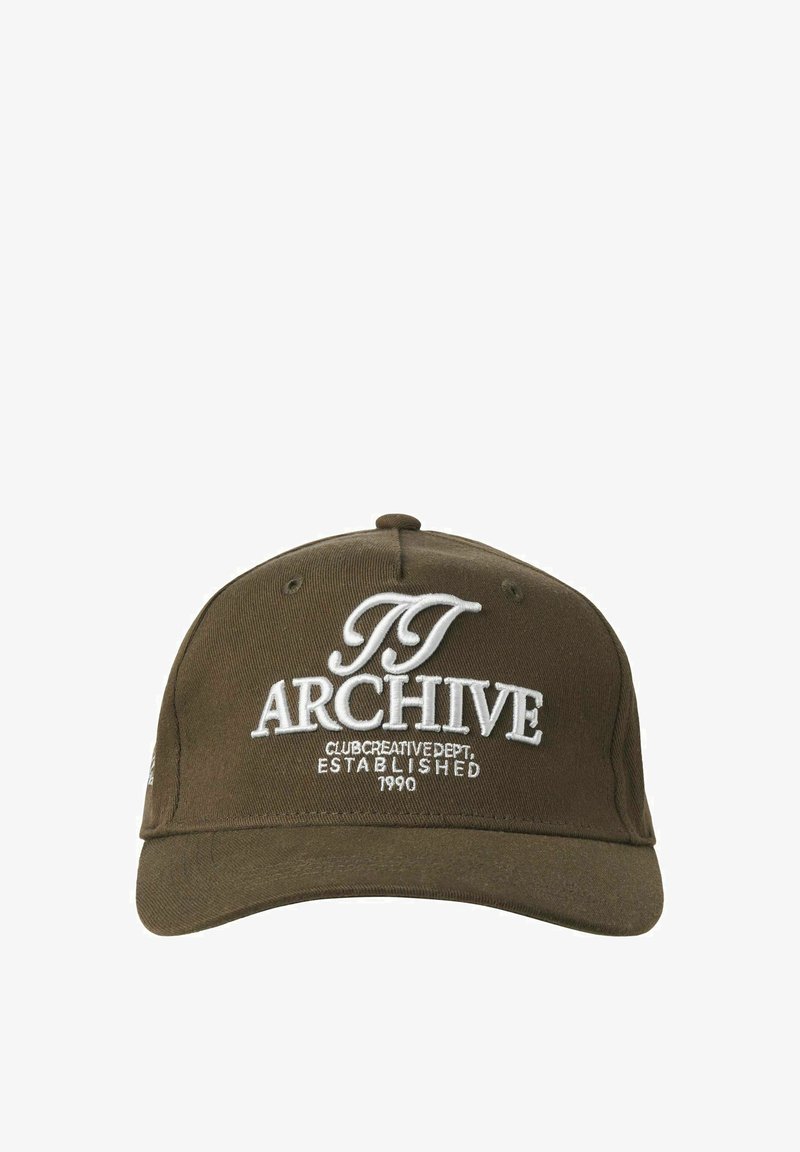 Olive green cap with a curved brim, featuring white embroidered text "ARCHIVE CLUB CREATIVE DEPT. ESTABLISHED 1990" on the front.