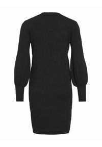 Zwarte gebreide jurk met lange ballonmouwen en een ronde halslijn. Aansluitend model met geribbelde manchetten en zoom. Smooth textuur, minimale details.