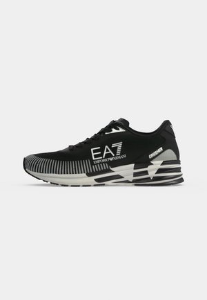 Черна маратонка за бягане Emporio Armani EA7 Crusher с бели шарени детайли и дебела подметка на райета, показана в профил.
