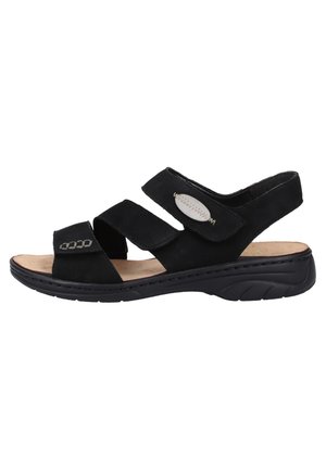 Sandale en suede noir avec trois bride réglables, semelle intérieure légèrement rembourrée et semelle extérieure noire durable. Présente des accents en métal argenté décoratifs.