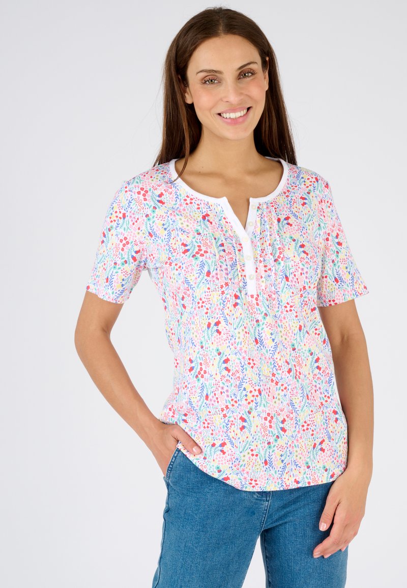 Korte mouwen bloes met bloemenmotief in het wit, met een kleurrijk patroon van rode, blauwe en groene bloemen, een knoopsluiting en een ontspannen pasvorm.