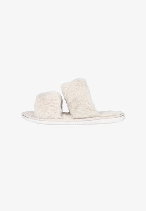 Sandale glissière beige douce et duveteuse avec deux larges brides et une semelle plate blanche, conçue pour une utilisation en intérieur ou pour un port décontracté.