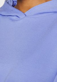 Nike Performance Jersey con capucha - lilac
