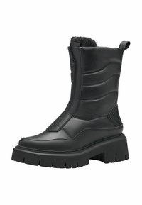 Bottine noire avec un design rembourré, dotée d'une fermeture éclair sur le côté, d'une doublure en fausse fourrure sur le haut et d'une semelle épaisse et crantée.