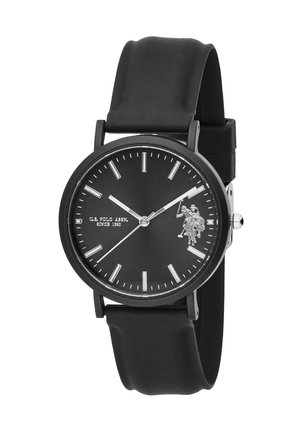 Orologio da polso nero con quadrante rotondo, indici delle ore argentati, logo U.S. Polo Assn. e cinturino in gomma nero che segna l'ora 10:10:09.