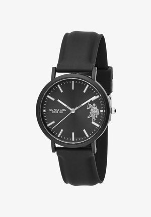 Orologio da polso nero con quadrante rotondo, indici delle ore argentati, logo U.S. Polo Assn. e cinturino in gomma nero che segna l'ora 10:10:09.