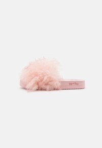 Pink flip-flop slide with fluffy textured upper, thick sole, and branding on the side. Features soft, fuzzy material for comfort.
