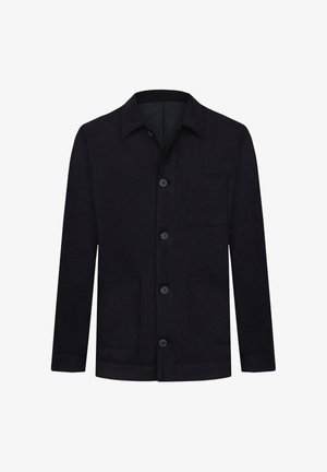 Schwarze, knöpfbare Jacke aus einem strukturierten Stoff. Sie verfügt über einen spitzen Kragen, zwei Fronttaschen und eine Brusttasche.