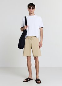 Calliope GINNICO - Pantaloni sportivi - beige