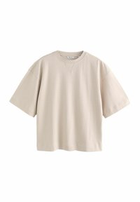 Beżowa bawełniana oversize t-shirt z okrągłym dekoltem, krótkimi rękawami i prostym dołem. Posiada subtelny detal przeszycia przy dekolcie.