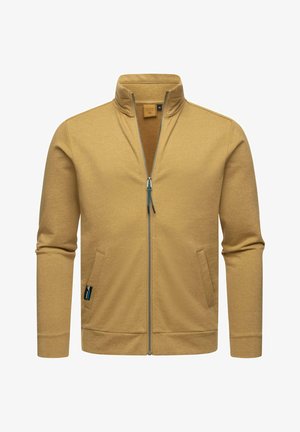 Giacca zip-up color beige con col alto, due tasche anteriori e zip a contrasto. Tessuto morbido con un taglio aderente e polsini a coste.