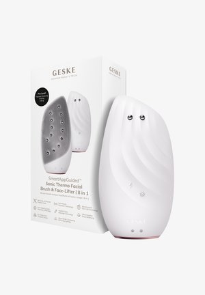 SmartAppGuided hvid sonisk termo ansigtsbørste og ansigtsløfter med opstrammende kugler, vist ved siden af sin mærkede produktæske.