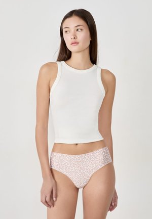 White ribbed sleeveless top with a round neckline, paired with pink animal print underwear, with smooth textures and a fitted design.