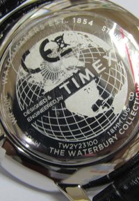 Silver stainless steel watch back with globe design, Timex logo, and engraved details. Features WR 50M and model number TW2Y23100.