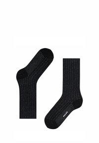Schwarze gerippte Socken mit einem subtilen Schimmer, featuring einen einfarbigen schwarzen Zehen- und Fersenbereich. Markenlogo sichtbar an der Seite einer Socke.