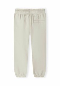 Light beige sweatpants with an elasticated waistband, tapered cuffs, and a single back pocket featuring a minimalist design.