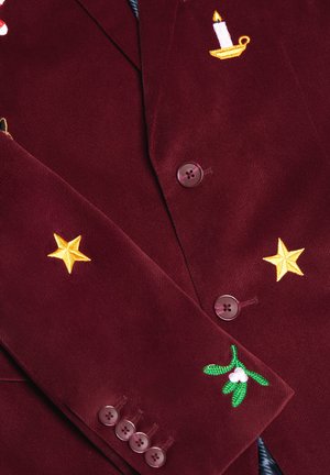 Burgundy corduroy blazer with embroidered yellow stars, candle, and mistletoe. Features brown buttons and textured fabric.