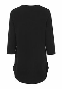 Zwarte tuniek gemaakt van zachte stof, met driekwart mouwen en zijzakken. Soepele textuur met een afgeronde zoom.