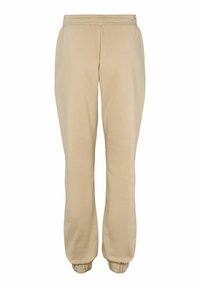 Beiga sweatpants gjorda av mjukt tyg, med elastisk midja och manschetter, avslappnad passform och utan synliga mönster eller detaljer.