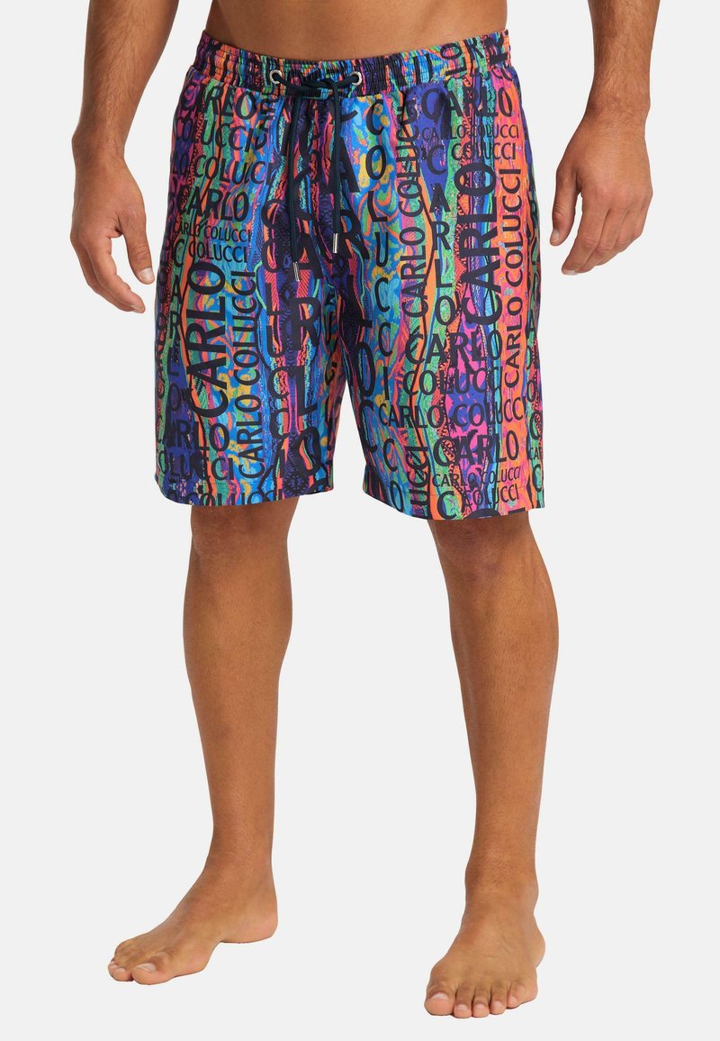 Multicolored swim shorts featuring a bold graphic pattern with text. Made from lightweight material, they have an elastic waistband and drawstring.