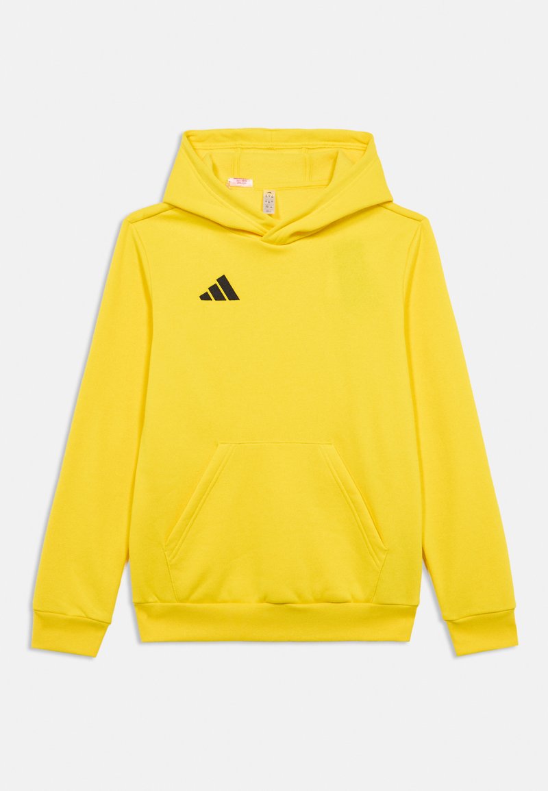 Κίτρινη κουκούλα με μπροστινή τσέπη, κουκούλα με κορδόνια και μαύρο λογότυπο Adidas στην αριστερή πλευρά του στήθους. Μαλακό ύφασμα και ριμπ μανίκια.