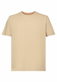 T-shirt beige à manches courtes et col rond, avec un tissu lisse et un subtil détail orange à l'intérieur du col.