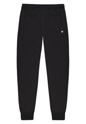 Pantaloni della tuta neri con cintura elastica, tasche laterali e polsini in costina. Presenta un piccolo logo sulla parte superiore della coscia sinistra.