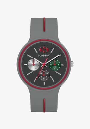 Hallikas silikoonist kell tumehallide näo, punaste aktsentide, kolme al skaalaga ja hõbedaste, roheliste ning mustade kroonograafi elementidega.