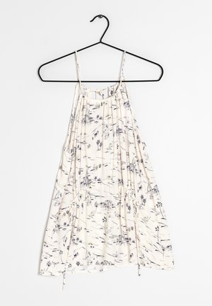 Débardeur léger en crème avec des bretelles fines et des détails froncés. Présente un motif de croquis marine de paysages et de palmiers.