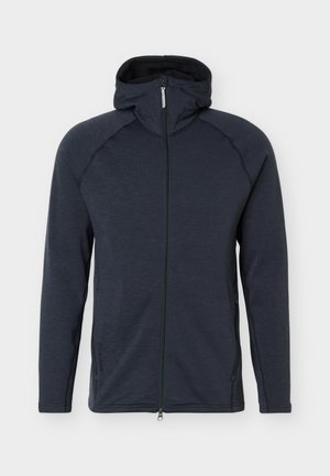 Mørkegrå hettegenser med glidelås, lange ermer, frontlommer og hette med høy krage, vist på en enkel lys bakgrunn.