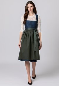 Traditional dress with a dark blue top, lace sleeves, and a long green skirt featuring a textured pattern and bow detail at the waist.