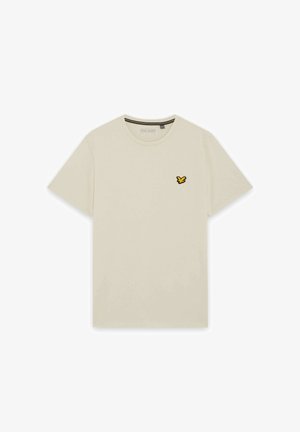 Beige T-shirt med korte ærmer og rund hals, med en lille gul og sort fuglelogo på venstre bryst.