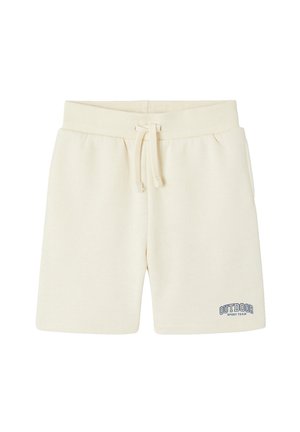 Cremefarbene Shorts mit elastischem Bund und Kordelzug, mit der Aufschrift "OUTDOOR SPORT TEAM" am linken unteren Bein.