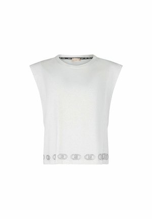 Top bianco a maniche corte con scollatura rotonda. Presenta una finitura tessurizzata e un bordo decorato in alto contrasto nero.