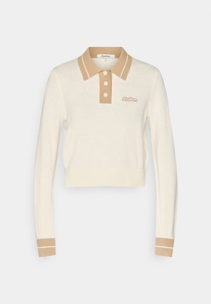 Cropped cream long-sleeve polo sweater with beige collar, button placket, cuffs, and small embroidered logo on chest.