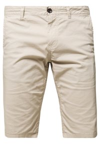 Beżowe, sięgające kolan, luźne szorty z szlufkami na pasek i zapięciem na guzik, wykonane z lekkiego materiału.