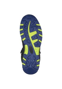 Sula på en sneaker med en texturerad blå gummibas och kontrasterande gula mönster för grepp och stabilitet.