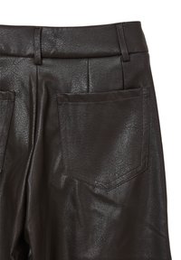 Brown faux leather pants featuring a textured finish, smooth surface, belt loops, and two back pockets with angular flaps.