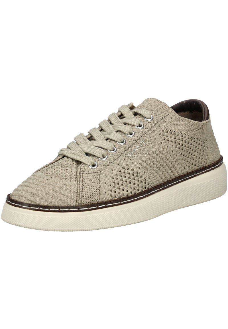 Adidași tricot beige cu un superior texturat, închidere cu șireturi și o talpă din cauciuc albă, având un accent cusut maro de-a lungul marginii.