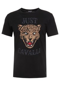Černé tričko s krátkým rukávem se znakem zlého tygra a textem "JUST CAVALLI" nad a pod ilustrací.