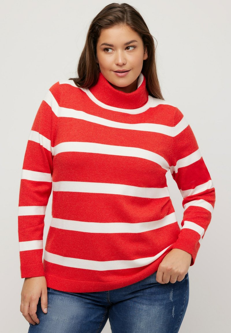 Röd och vit randig polotröja med långa ärmar, ribbade muddar och nederkant. Mjuk tyg med avslappnad passform och enfärgad halsringning.