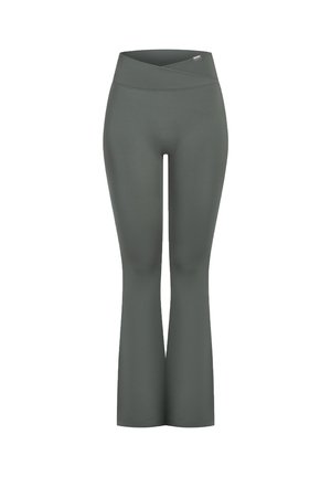 Leggings acampanados en un verde oscuro, fabricados con un tejido elástico. Cuentan con una cinturilla ancha y cruzada, y una textura suave y sin costuras.