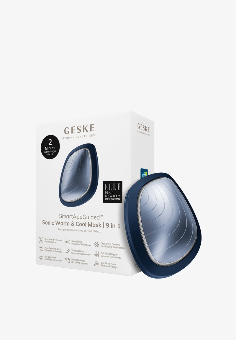 Masque Sonic Warm & Cool SmartAppGuided™, design ergonomique bleu foncé, surface argent réfléchissante, doté d'une technologie électronique pour les soins de la peau.