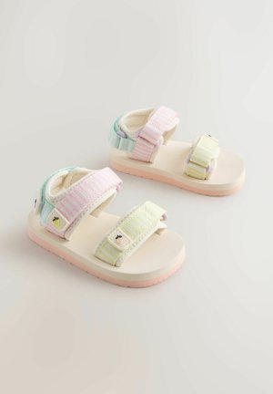 Sandale pentru copii cu tălpi moi bej, barete cu dungi pastelate în roz, albastru și galben, decorate cu accente animale pe închizători.