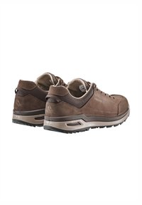 Brown suede hiking shoes with mesh accents, cushioned collar, and textured rubber sole. Features logo detail and durable stitching.