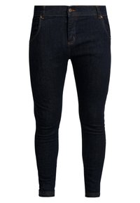 Jeans ajustados de mezclilla azul oscura con un diseño clásico de cinco bolsillos, con costuras naranjas y cierre de botón. Textura suave y forma ajustada.